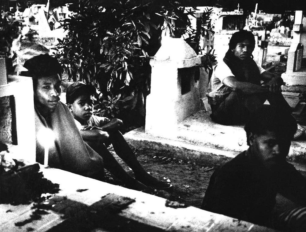 Youths hiding in the grounds of Santa Cruz cemetary during purges by the Indonesian military