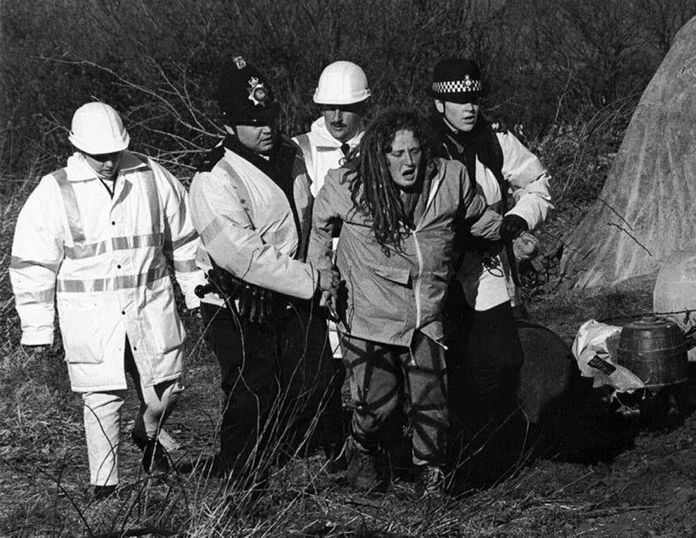 An activist is led away after an eviction at Brewery Fields, North Wales.